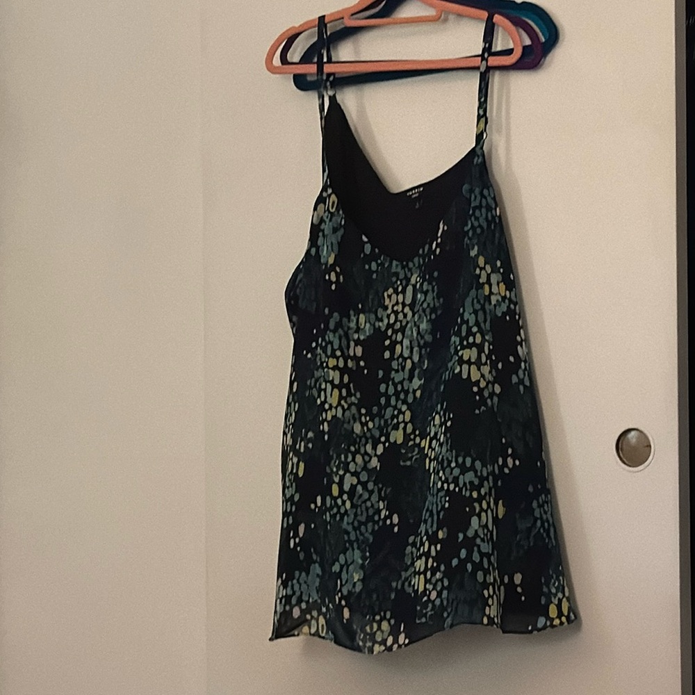 Torrid size 4 flutter top. Shades of blue and green over black.